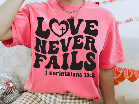 Love Never Fails Oversized Comfort Color - Glittering Boutique